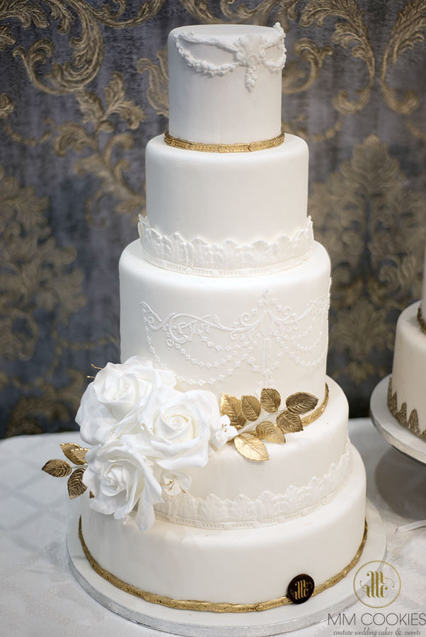 Elegant white with gold wedding cake